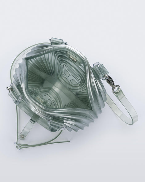 Top view of a  transparent blue Quantum Dome + Diesel bag with hand strap and shoulder strap