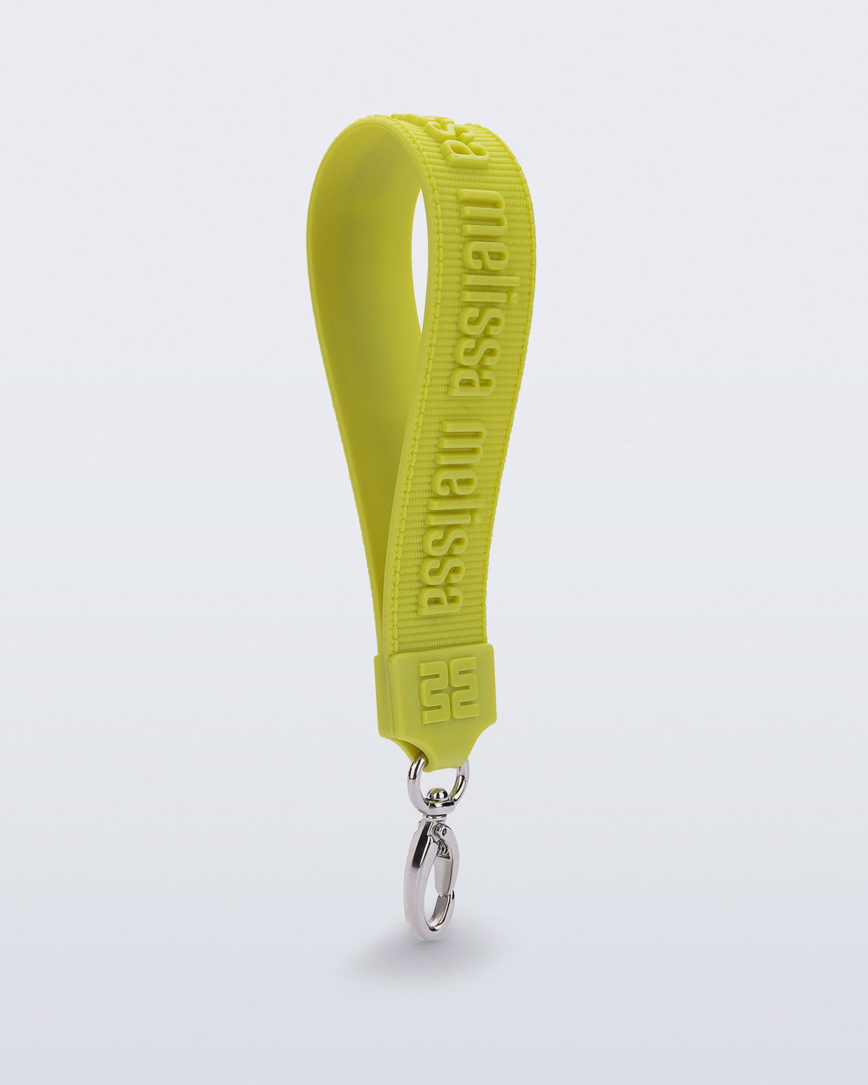 Angled view of a green M Lover Charm with the Melissa logo