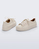 Back and angled view of a pair of beige Wow Sneakers with beige laces