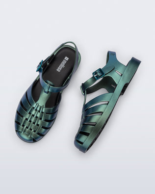 Top and side angled view of a pair of metallic magic green Possession Fisherman sandals