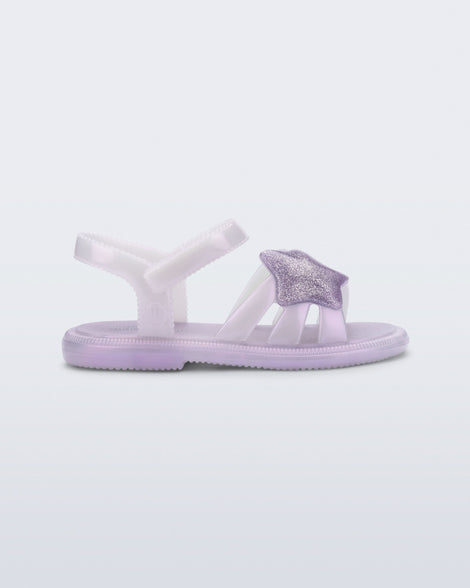 Side view of a pearly purple Hip Sky baby sandal with a glitter purple star on top