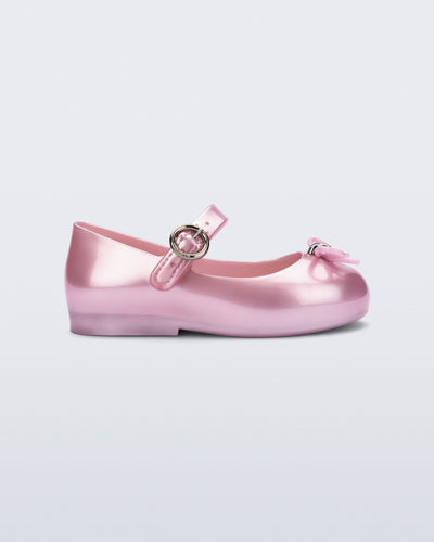 Side view of a pearly pink Sweet Love baby flat with bow