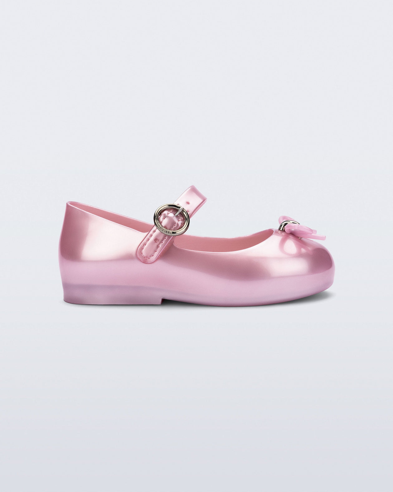 Side view of a pearly pink Sweet Love baby flat with bow