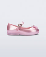 Side view of a pearly pink Sweet Love baby flat with bow
