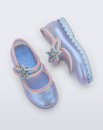 Side and top view of a pair of pearly blue Hip Ballerina Star baby flats with star on upper strap