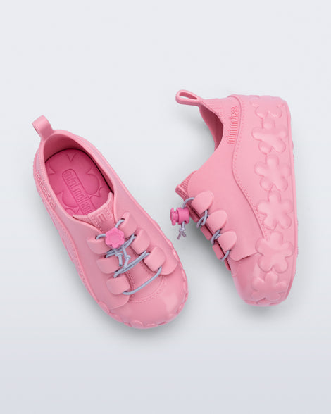 Top and side view of a pair of pink Bloomy Sneaker with lilac laces and flower details on the sole