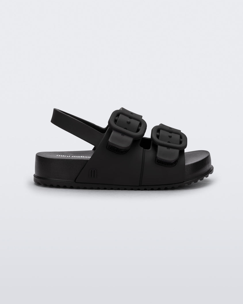 Side view of a matte black Mini Melissa Cozy sandal with two front straps with buckle detail