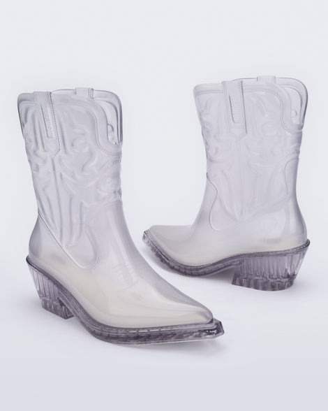 Angled view of a pair of clear Texas boots with pointed toe.