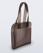 Angled view of a brown Harper bag with shoulder straps