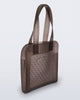 Angled view of a brown Harper bag with shoulder straps