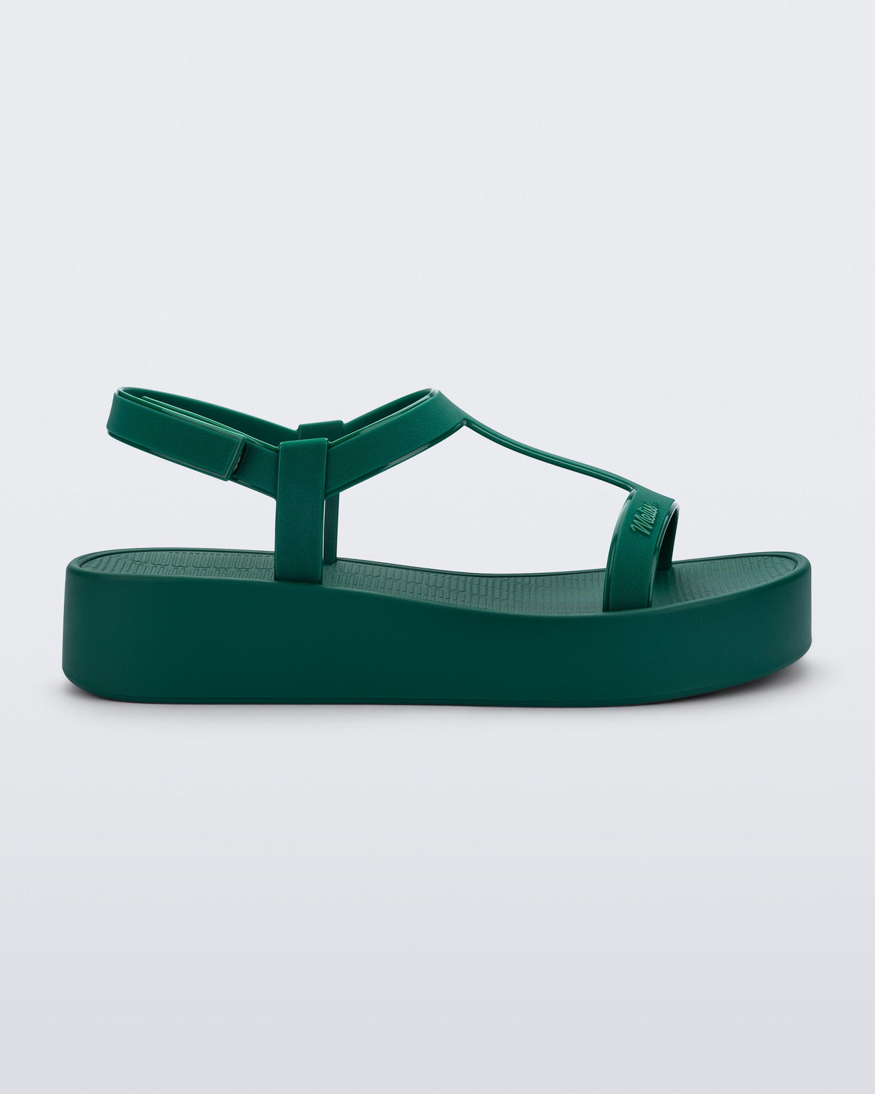 Side view of a green Sun Capri Platform sandal with ankle strap