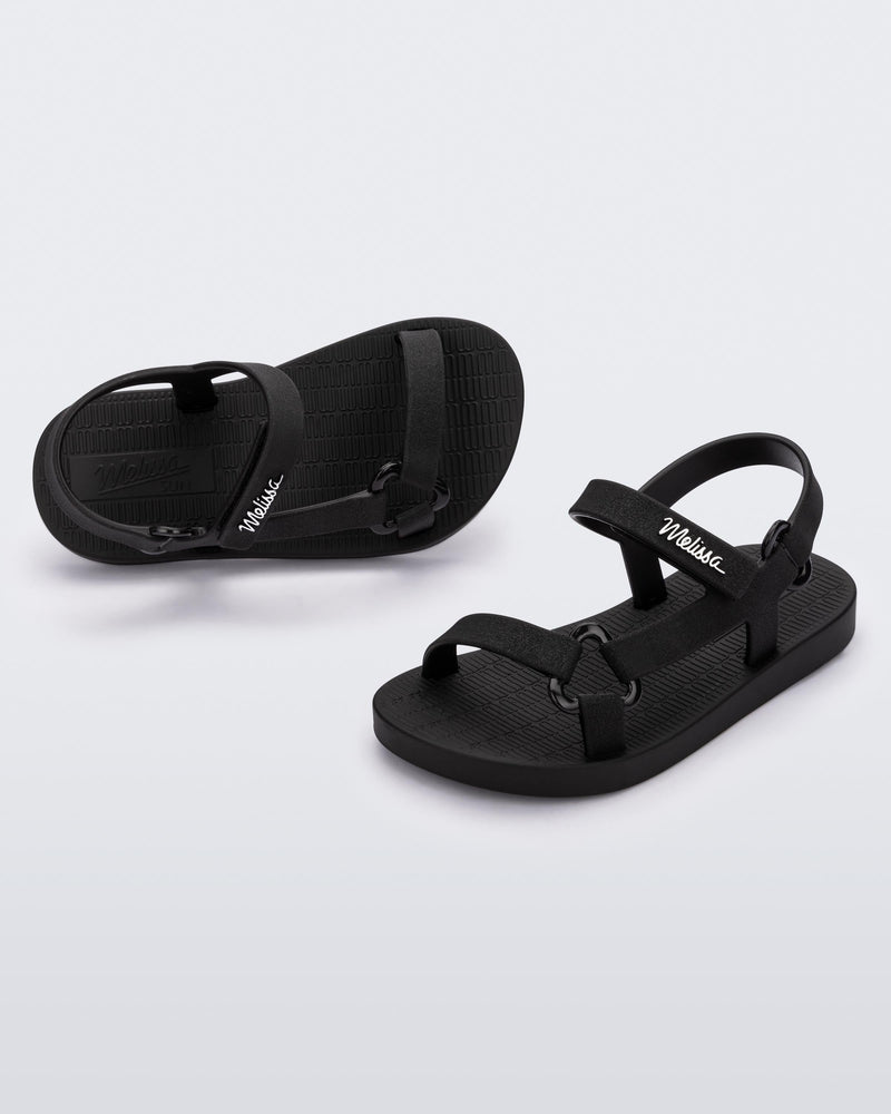 Top and angled view of a pair of black Sun Downtown baby sandals