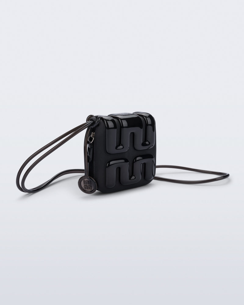 Front view of a black Jelly Wallet with inside pocket and zipper