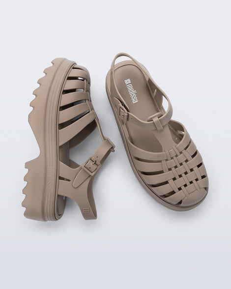 Top and side view of a pair of dark beige Possession Platform II sandals