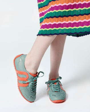 Product element, title Motion in Orange/Green
 price $99.00
