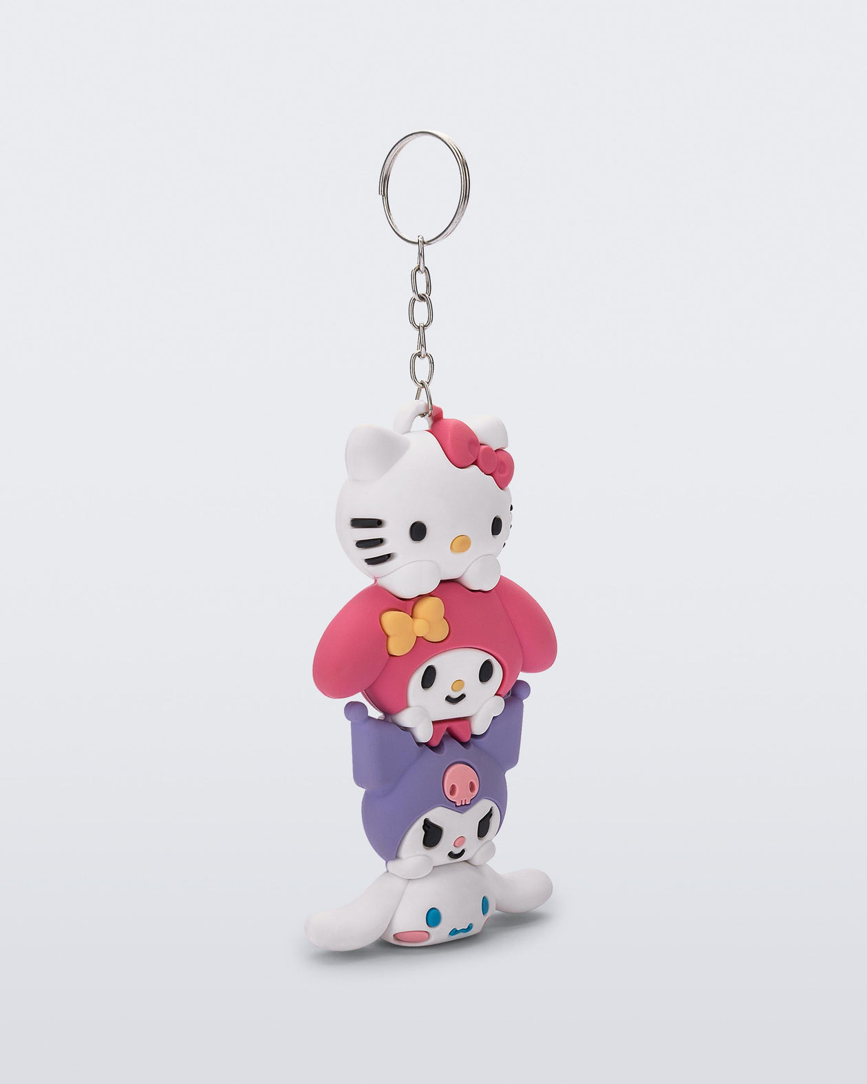 Angled view of a Hello Kitty + Friends charm keychain with Hello Kitty and two friends