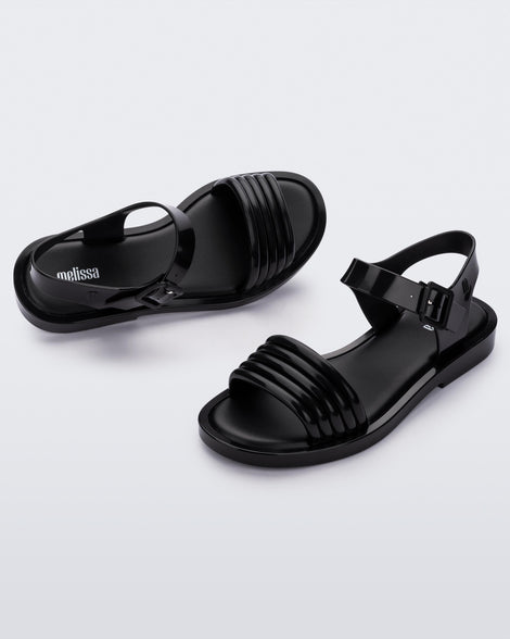 Angled view of a pair of black Mar Wave women's sandals.