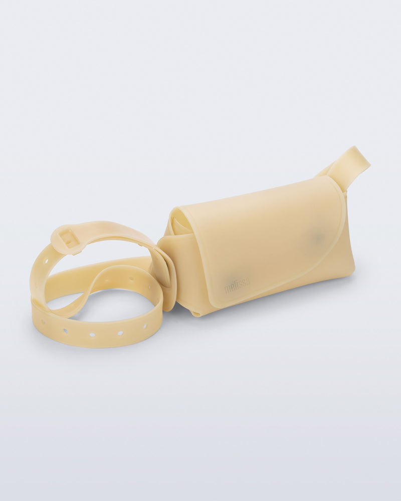 Angled view of a beige Cross Bag with adjustable strap