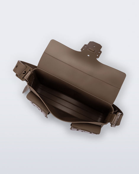 Top view of a brown Cargo bag with two small pockets on the front and an adjustable strap