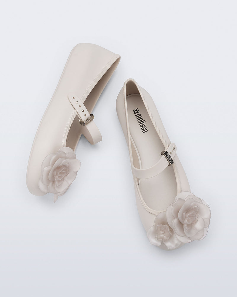 Top and side view of a pair of beige Soft Ballerina Petals flats