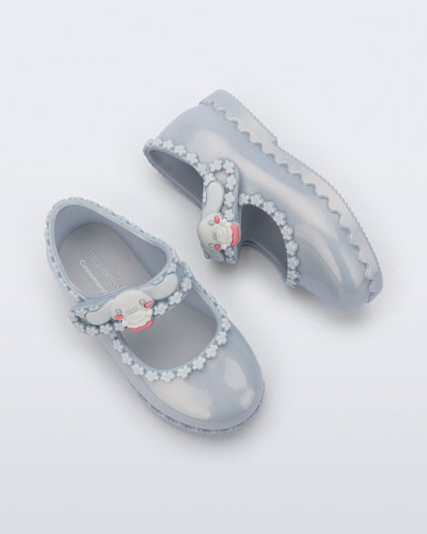 Top and side view of a pair of pearly blue Hip Ballerina + Hello Kitty baby flats 