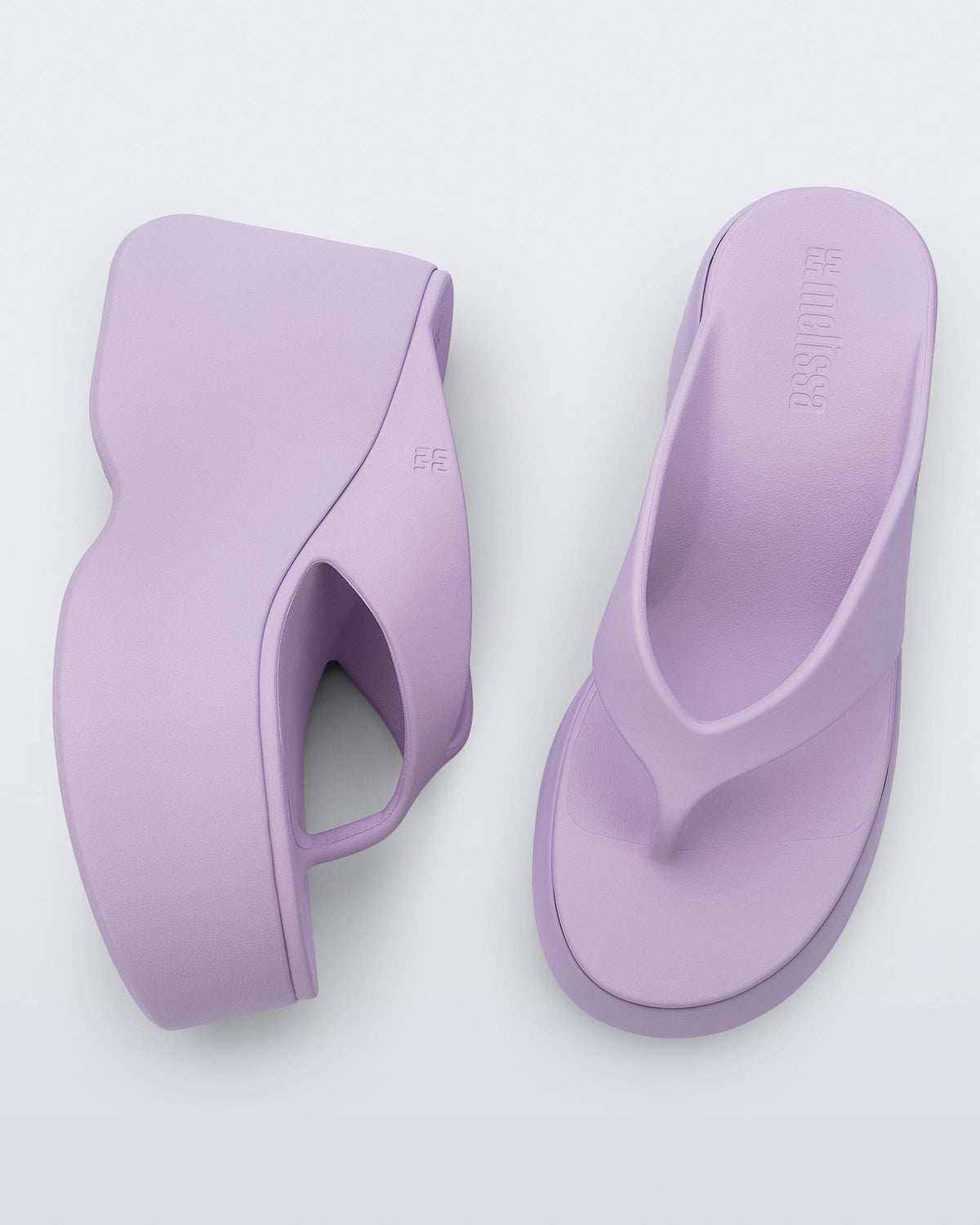 Top and side view of a pair of lilac Free Thong  Wedge Platform heels