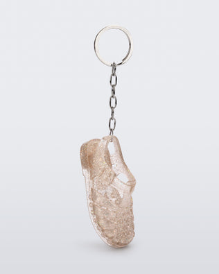 Side angled view of glitter beige Possession keyring