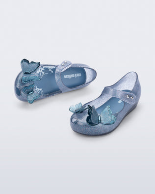 Top and angled view of blue glitter Ultragirl Butterfly baby flats with butterflies on top