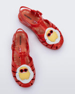 Top view of a pair of red Possession + Pop Mart Pucky fisherman kids sandal