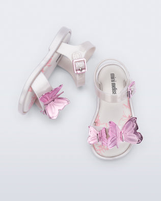 Top and side view of a pair of pearly white baby Butterfly sandals with pink butterflies