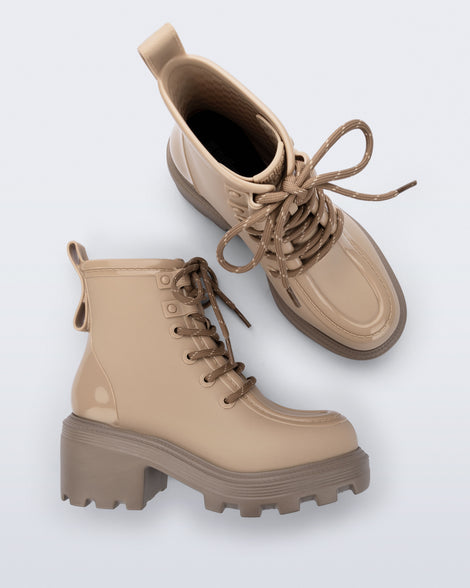 Top and side view of a pair of beige Track Boot with small heel and beige laces