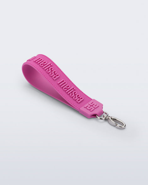 Angled front view of a pink M Lover Charm with the Melissa logo