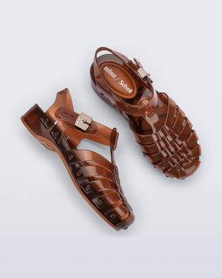 Side and top view of a pair of clear brown Possession Pescura + Scholl fisherman sandals