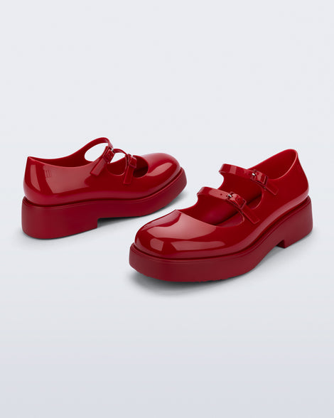 Side and angled view of a pair of red Farah Low Mary jane loafers