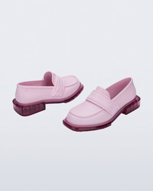 Back and angled view of a pair of pink Spencer loafers with clear pink soles