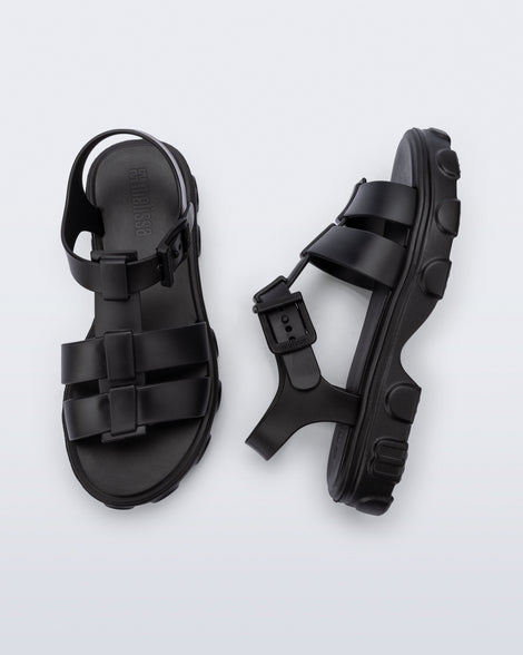 Top and side view of a pair of black Ella sandals
