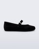 Side view of a black Soft Ballerina Velvet II flat