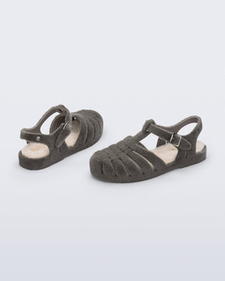 Back and angled view of a pair of grey fuzzy Possession Warm fisherman sandals with beige insoles