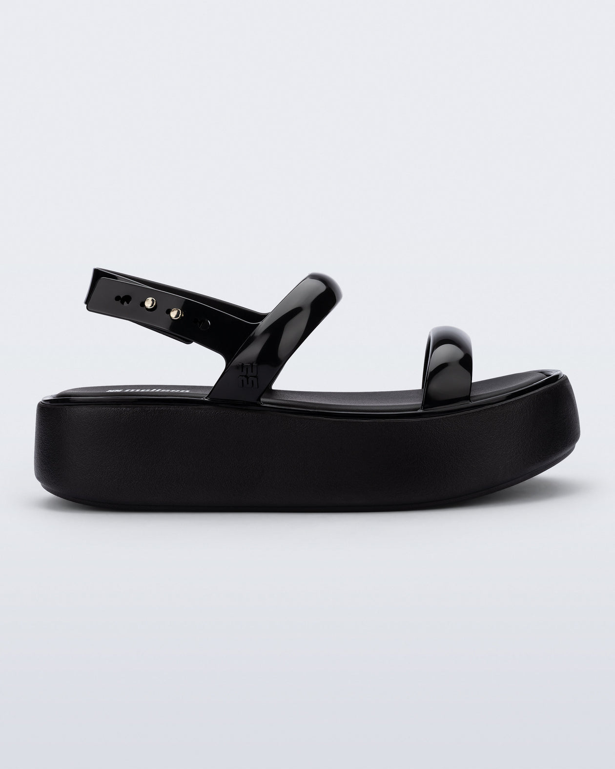 Side view of a black Wave Platform sandal with top and heel straps