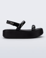 Side view of a black Wave Platform sandal with top and heel straps