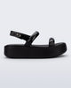Side view of a black Wave Platform sandal with top and heel straps