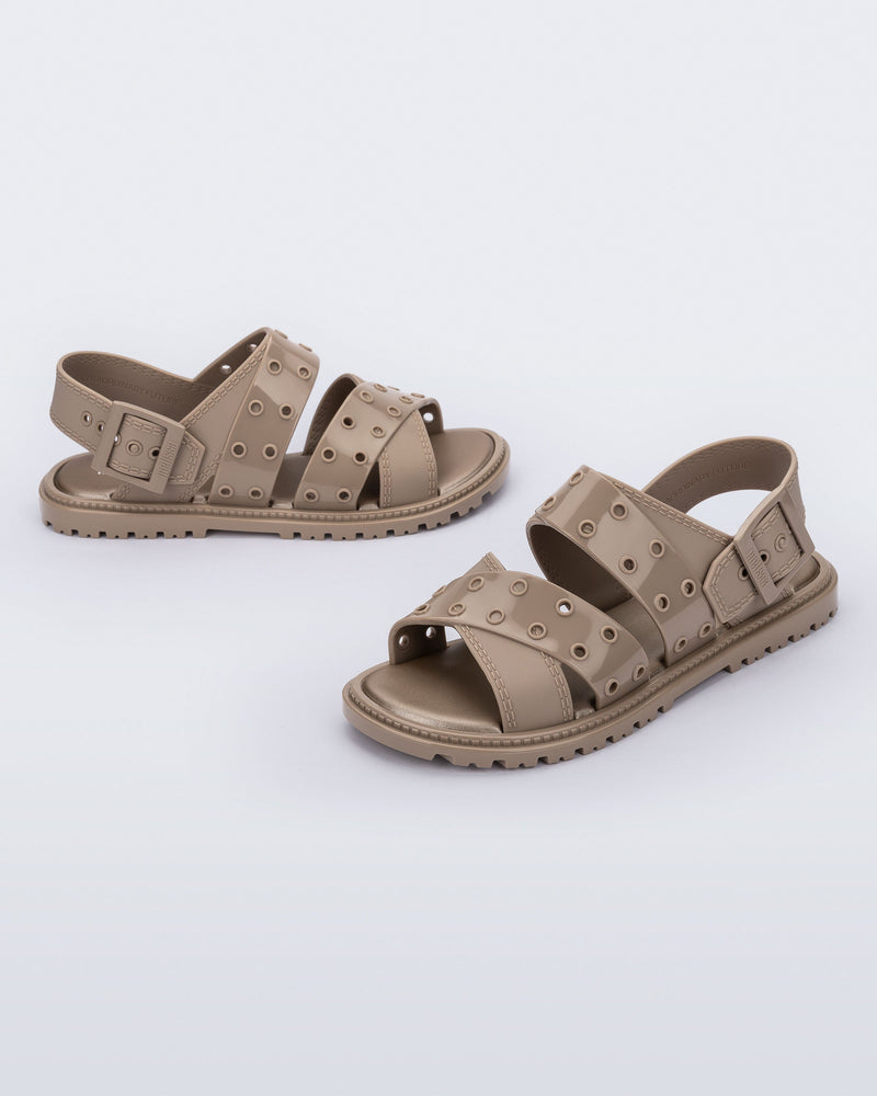 Side and angled view of a pair of beige Lock sandals with back strap
