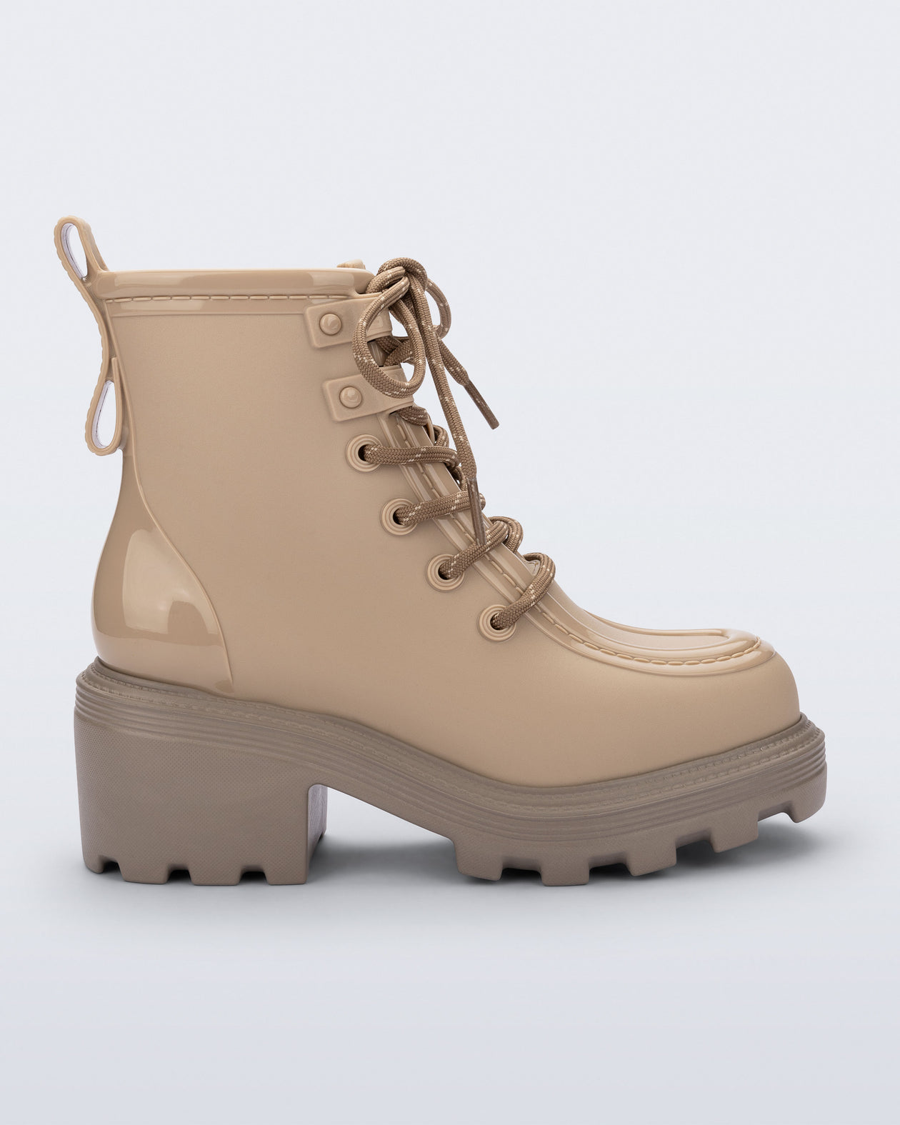 Side view of a beige Track Boot with small heel and beige laces