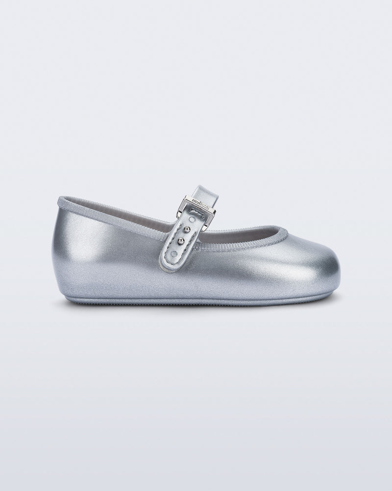 Side view of a pair of silver Soft Ballerina baby flat