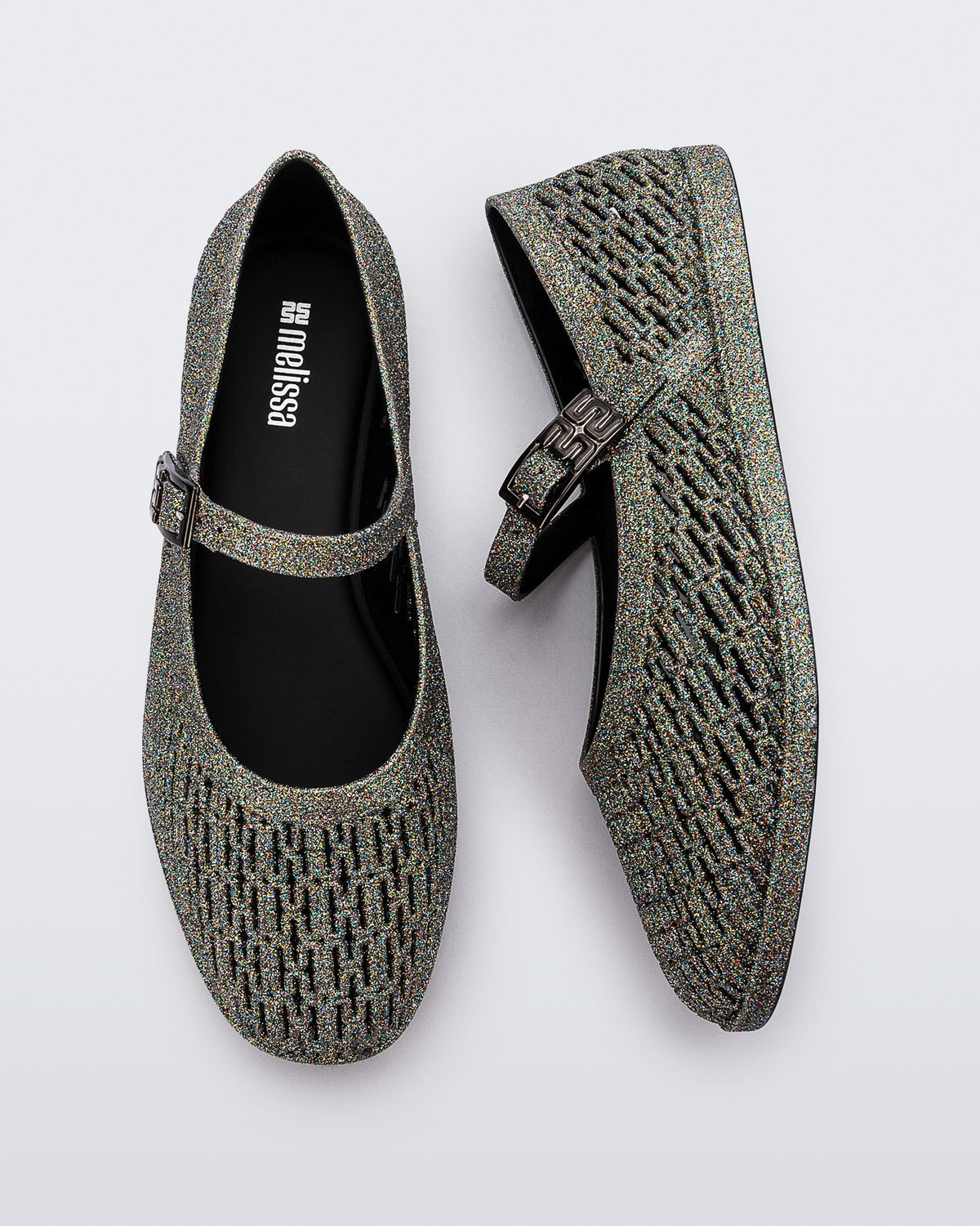 Top and side view of a pair of dark silver glitter Harper flat with strap