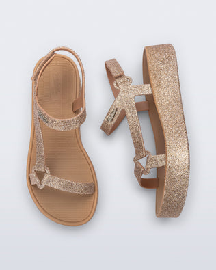 Top and side view of a pair of beige glitter Sun Downtown Platform sandals