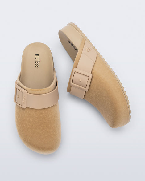 Top and side view of a pair of beige Cozy Clog Velvet slides