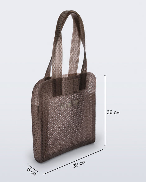 Angled view of a brown Harper bag with shoulder straps with bag measurements of 30cm x 6cm x 36cm