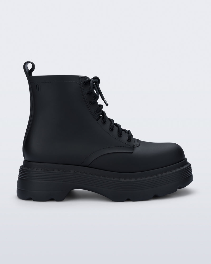 Side view of a matte black Coturno Soft Platform boot