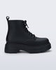 Side view of a matte black Coturno Soft Platform boot